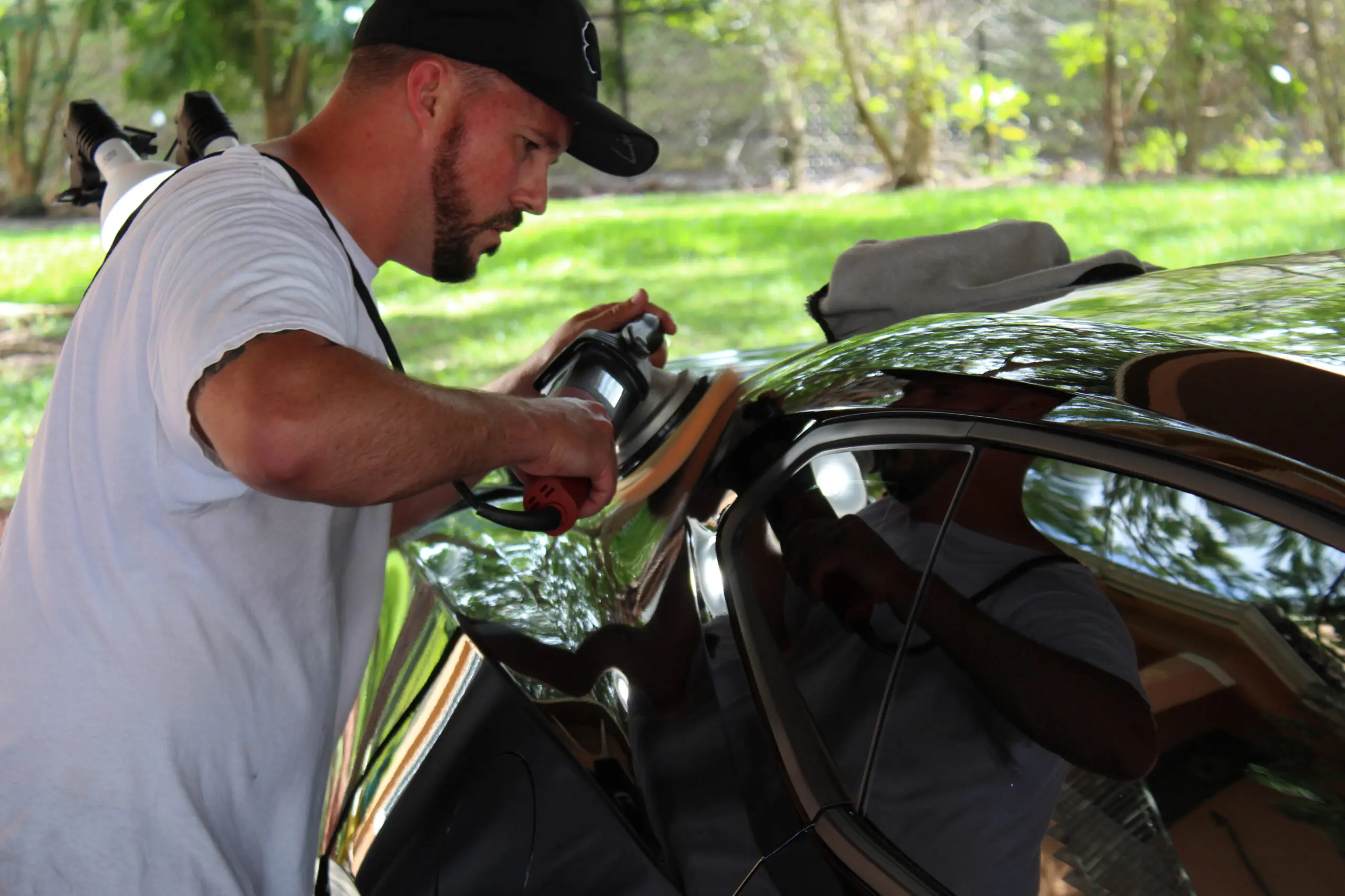 Justin machine polishing a vehicle's exterior
