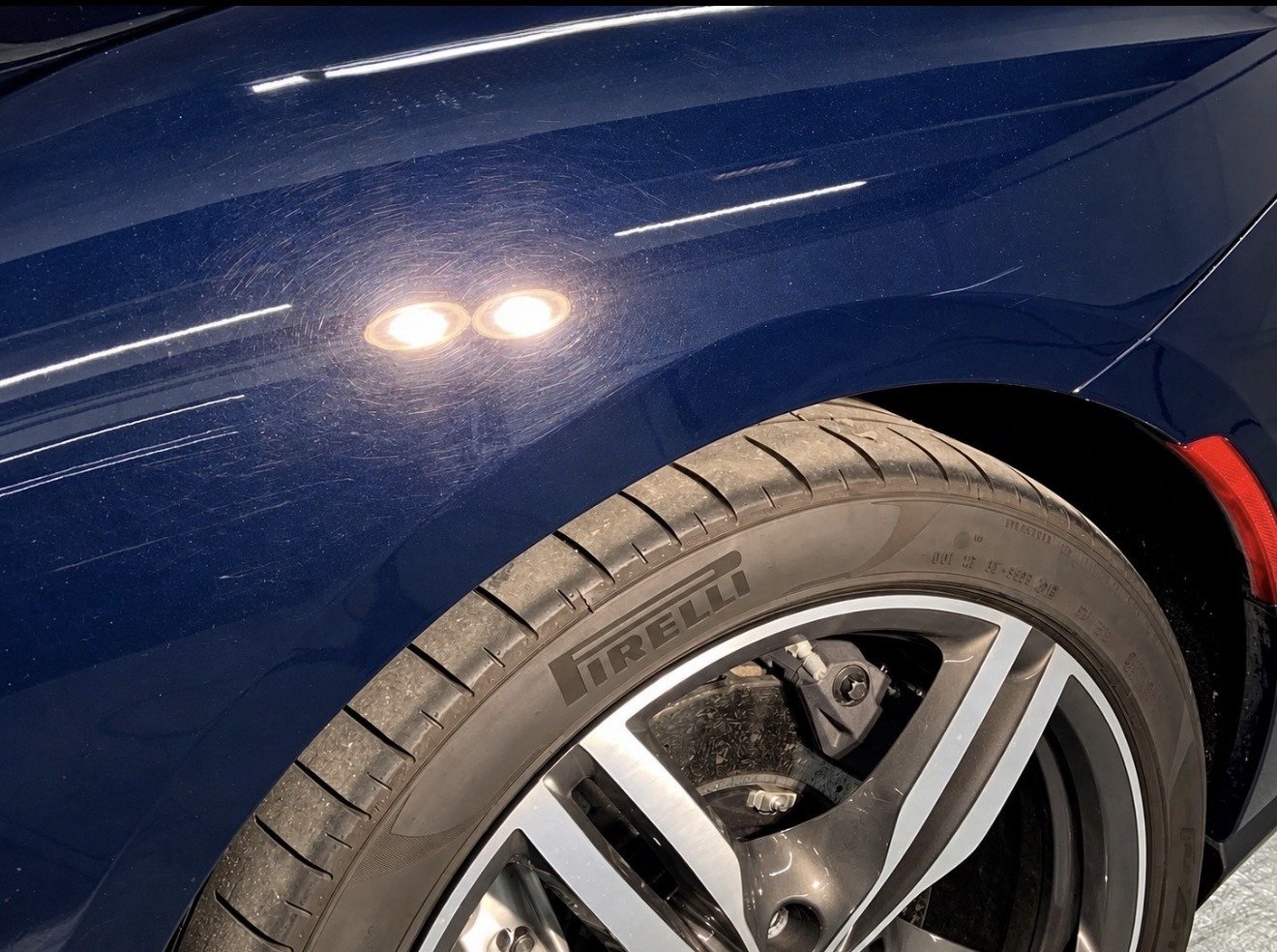 Ferrari paint showing swirl marks before professional paint correction in Fort Lauderdale